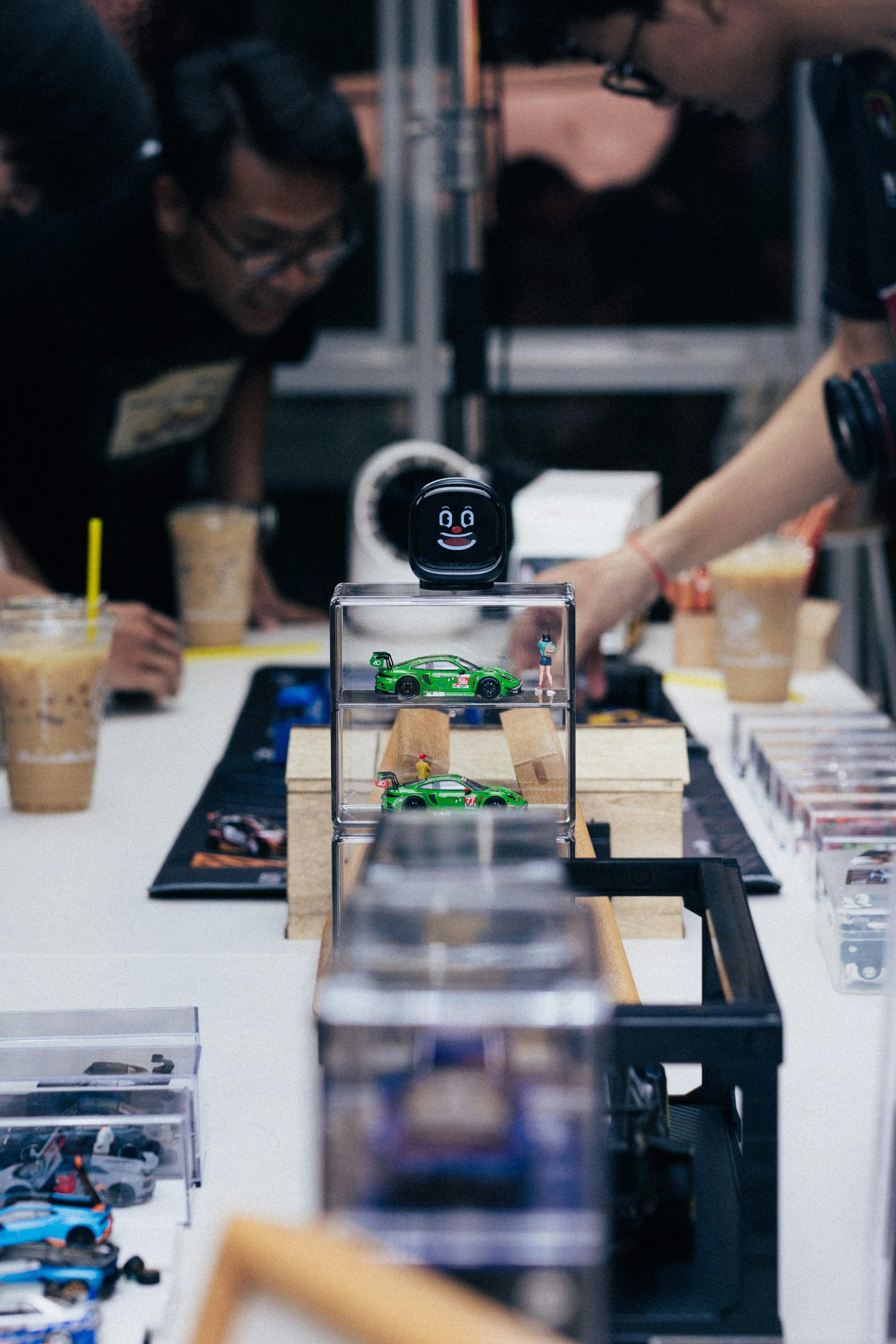 A vibrant display of scale model cars at an event in Phnom Penh, Cambodia.